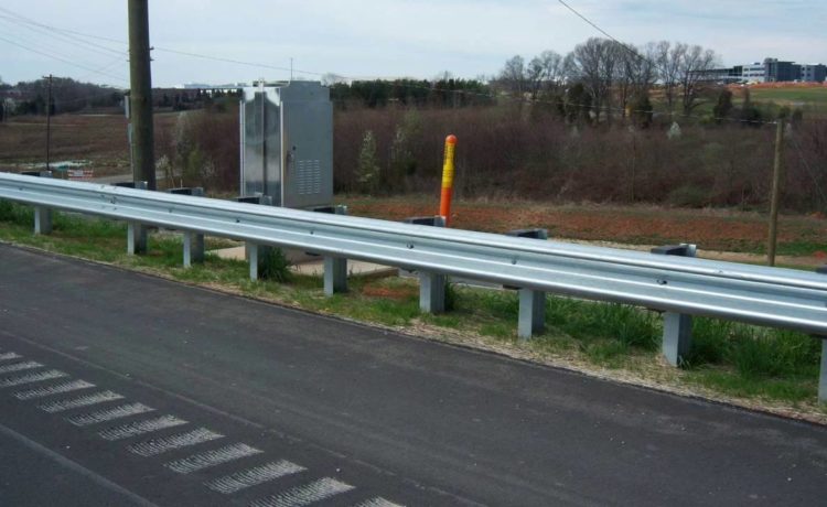 What is a highway guardrail